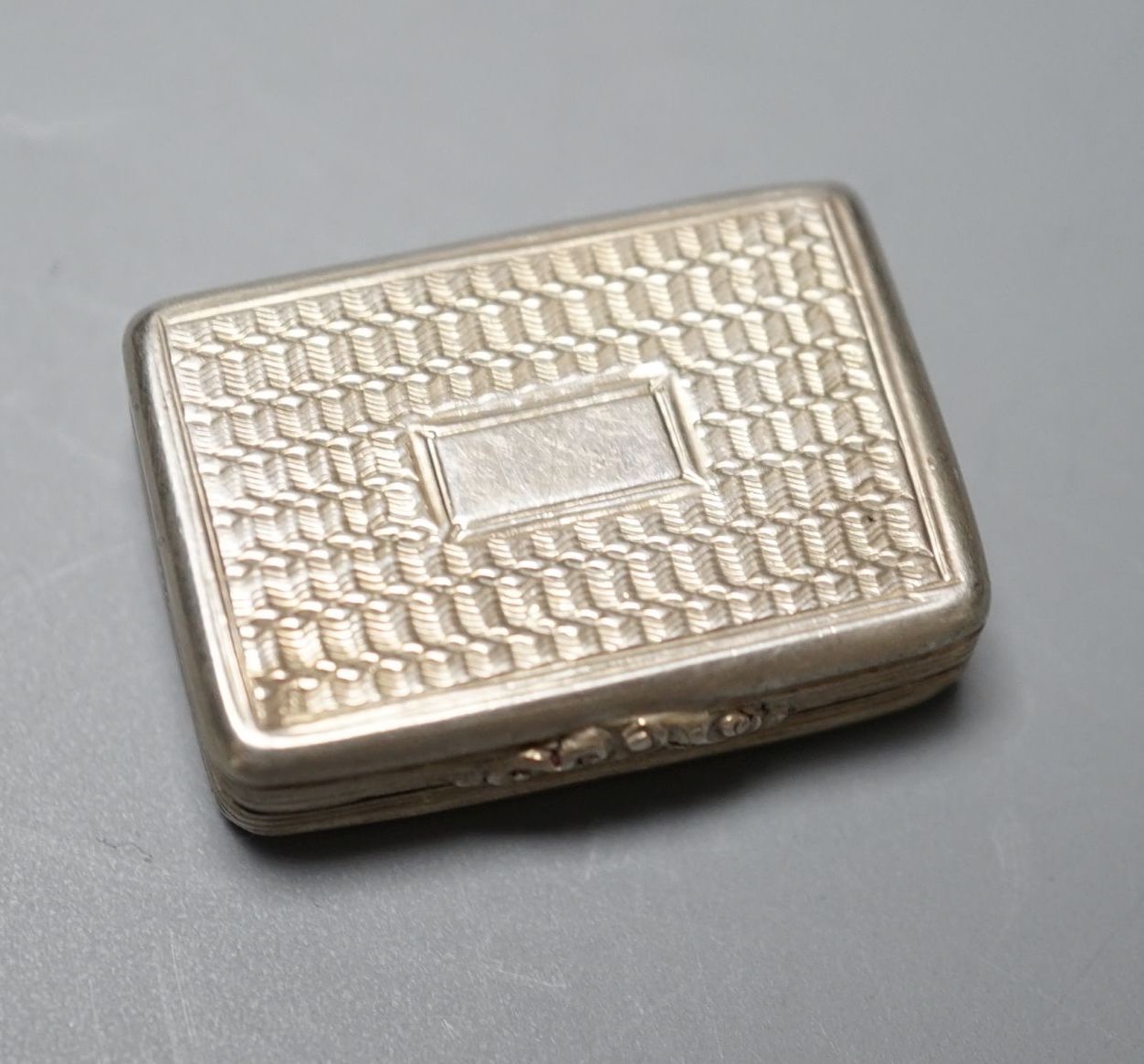 A William IV engraved silver rectangular vinaigrette, Taylor & Perry, Birmingham, 1831, 27mm.